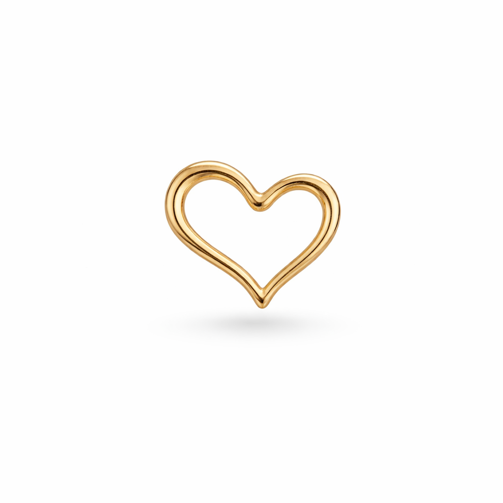 Gold heart-shaped earring on a white background