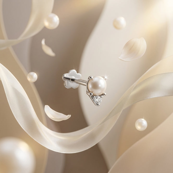 Pearl earring with diamond on a soft floral background