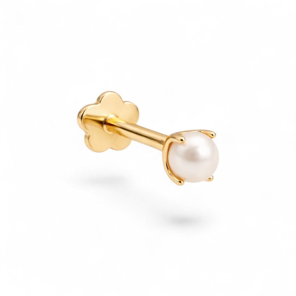 Petite 14K yellow gold baby pearl threaded labret earring with a smooth flatback and secure internal threading.