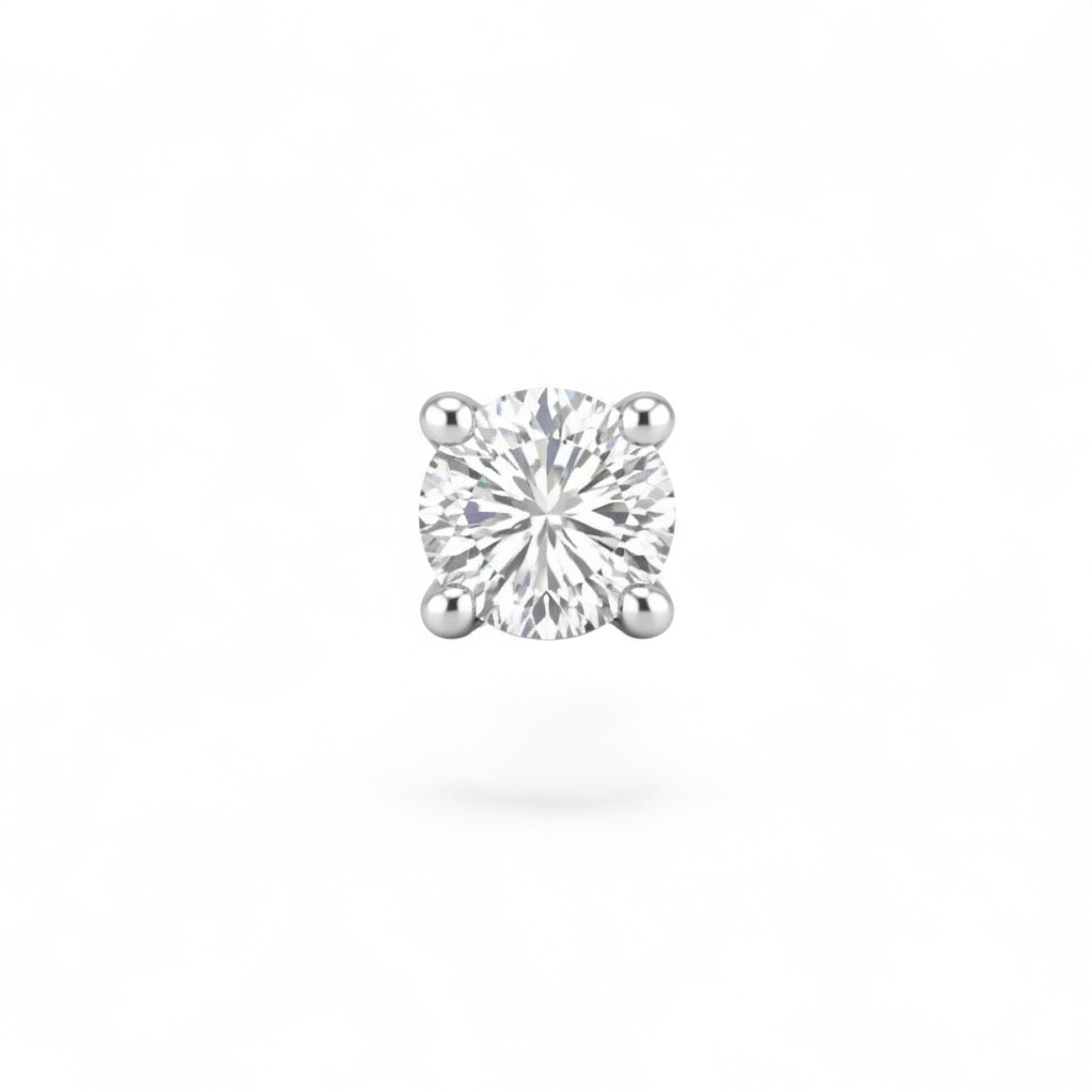 Single diamond earring on a white background