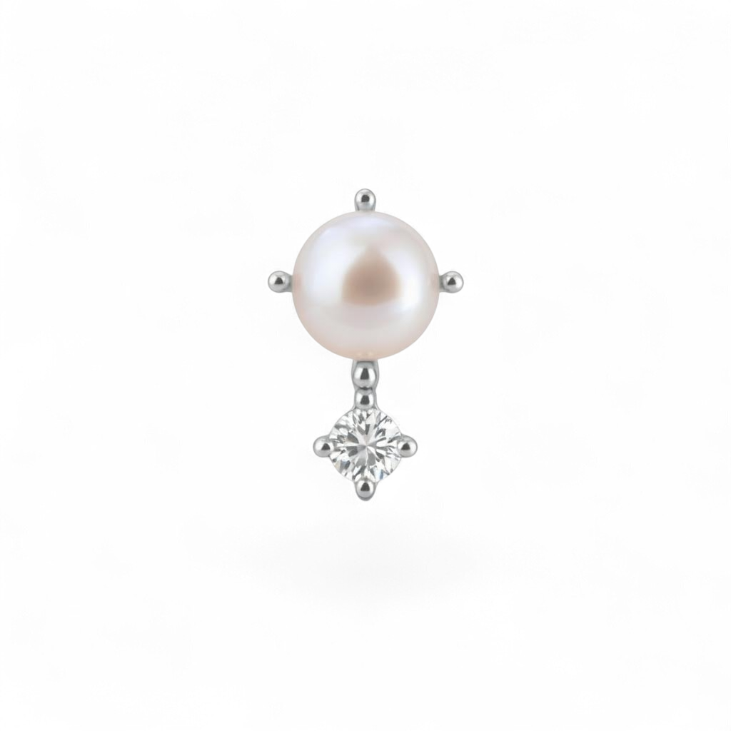 Single earring with pearl and diamond on a white background