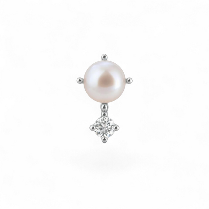 Single earring with pearl and diamond on a white background