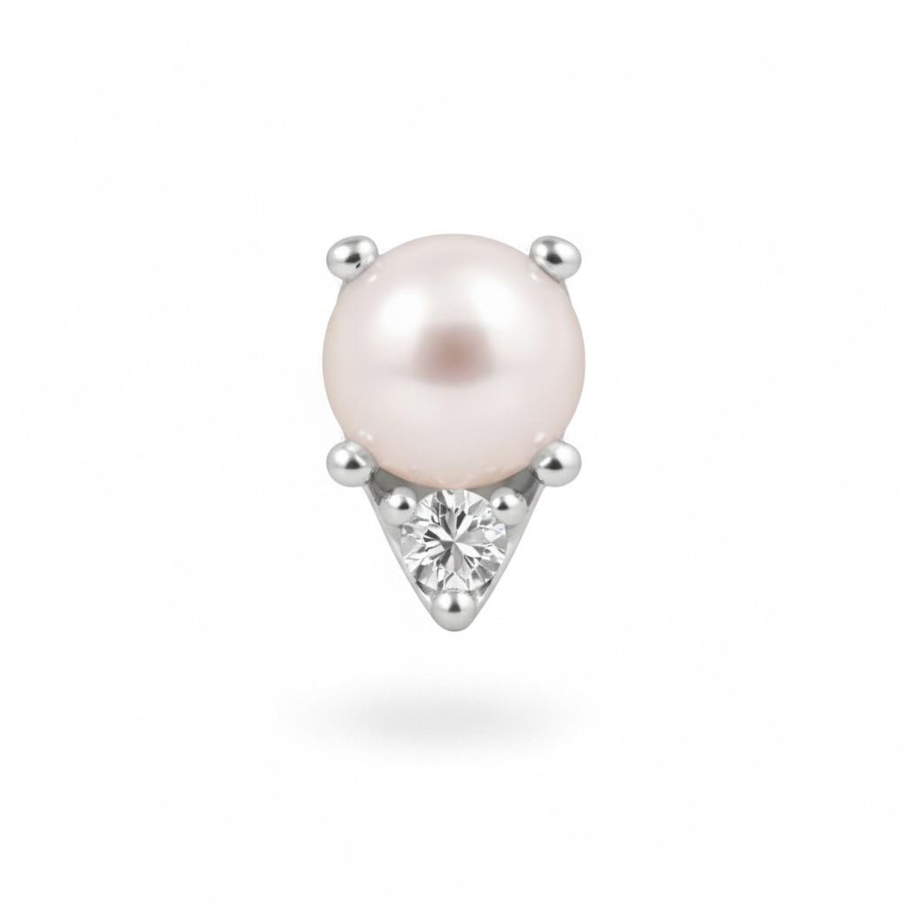 Single pearl earring with a diamond on a white background