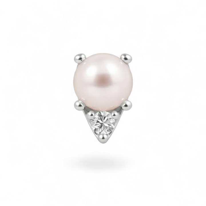 Single pearl earring with a diamond on a white background
