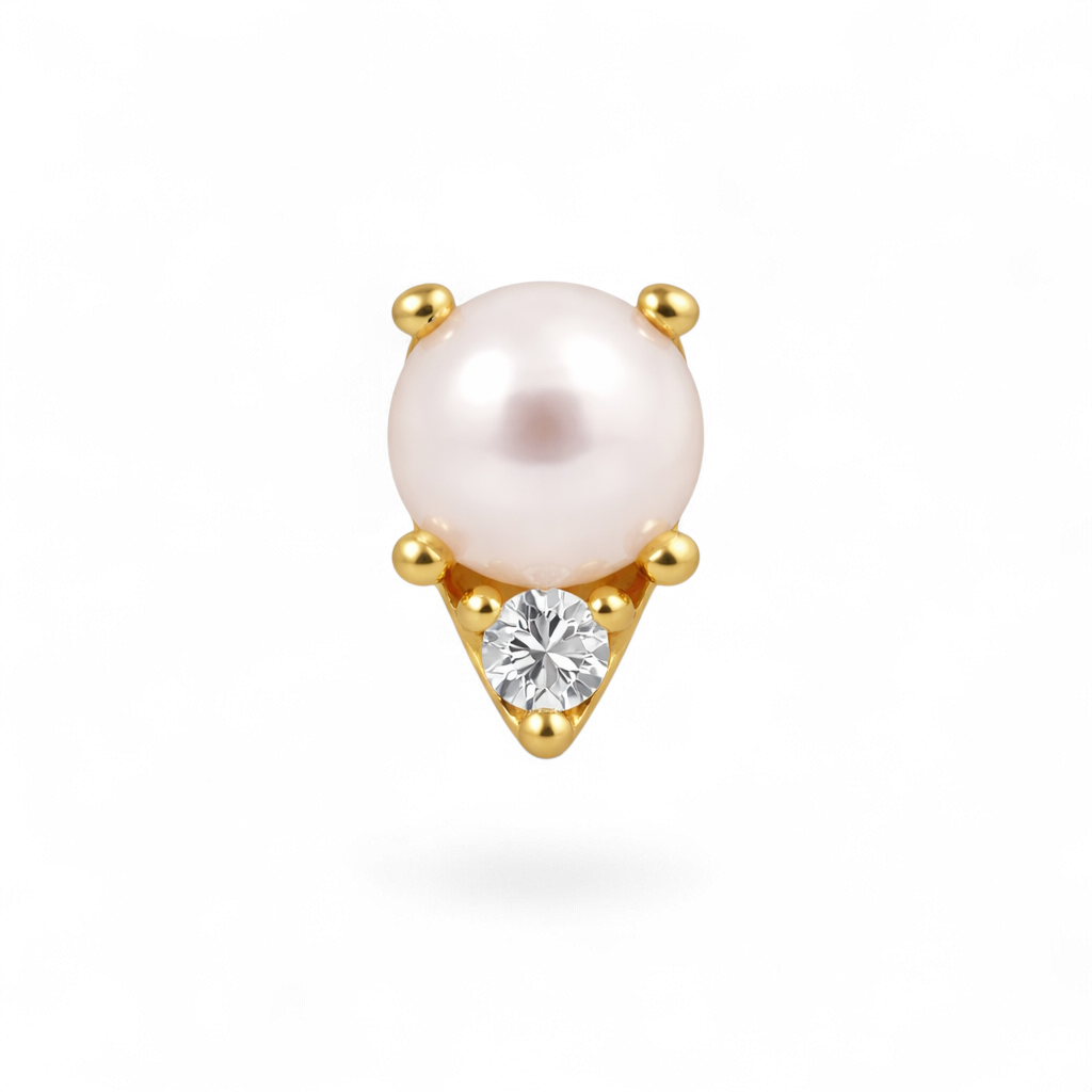 Single pearl earring with gold setting and clear gemstone on a white background