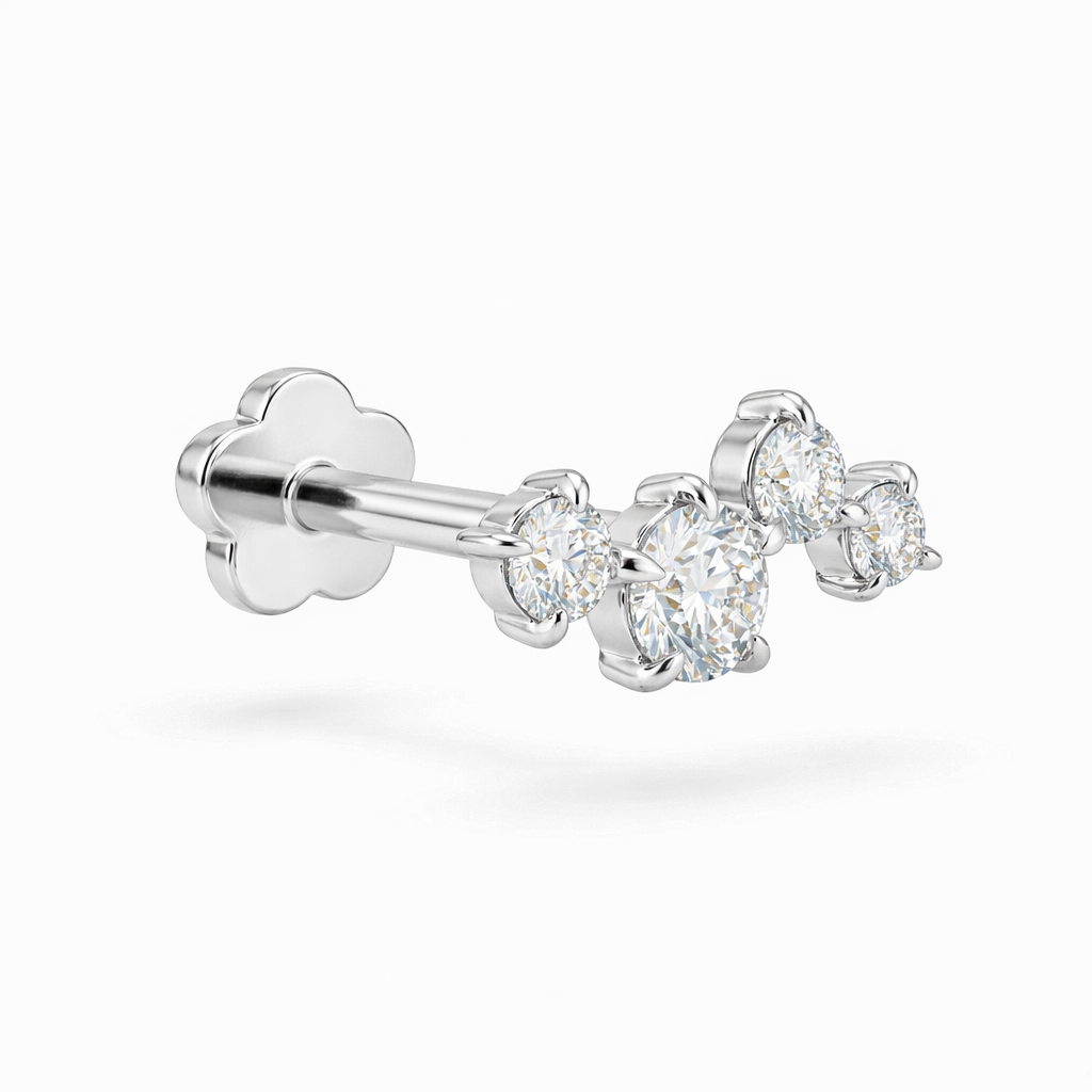 white gold earring with 4 clear gemstones on a white background
